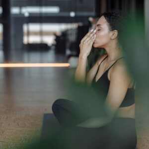Woman practising yoga at home